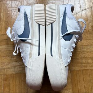 Nike Court Legacy in women’s size 10.5. Colors white, navy blue, and light tan.